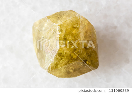 sample of raw green grossular garnet on white 131060289