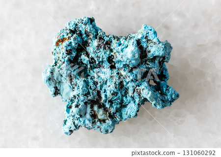 sample of raw shattuckite mineral on white marble 131060292