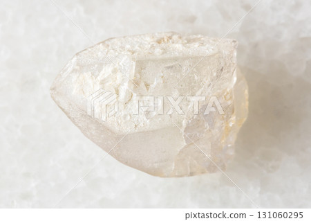 sample of raw rock-crystal on white marble sample of raw rock-crystal on white marble 131060295