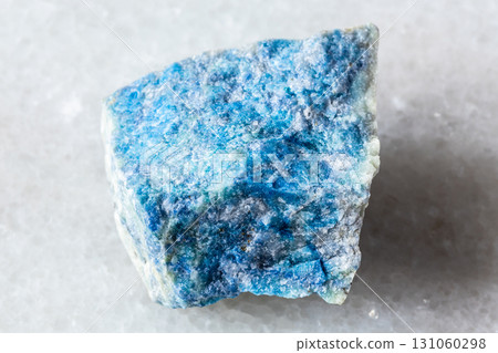 sample of rough lazurite mineral on white marble sample of rough lazurite mineral on white marble 131060298
