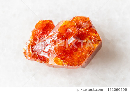 sample of rough vanadinite crystal on white marble sample of rough vanadinite crystal on white marble 131060306