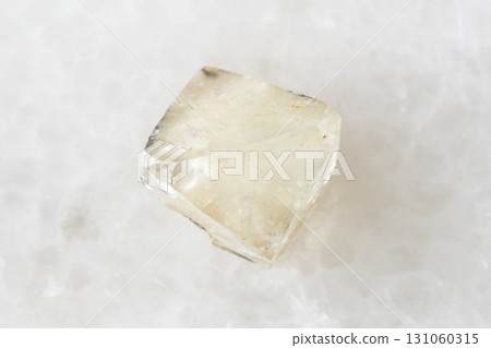 sample of rough topaz crystal on white marble sample of rough topaz crystal on white marble 131060315