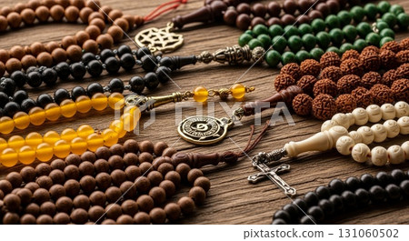 Collection of Religious Prayer Beads and Spiritual Jewelry on Wooden Background 131060502