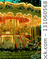 Christmas carousel with horses on the square in the city 131060568