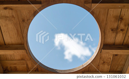 Looking Up at the Sky Through a Wooden Circle Looking Up at the Sky Through a Wooden Circle 131061032
