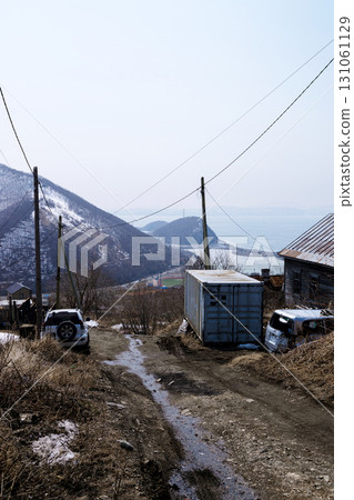 wet dirty road in Petropavlovsk-Kamchatsky city 131061129