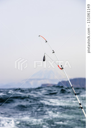 fishing rod and Koryakskaya Sopka in background 131061149