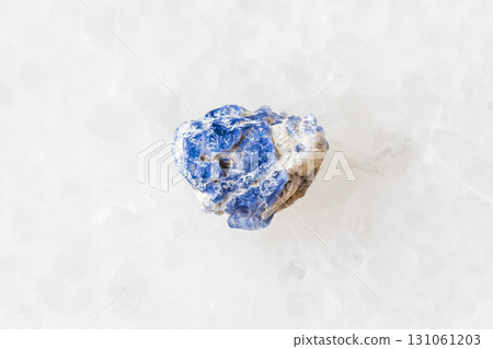 sample of raw blue spinel crystal on white 131061203