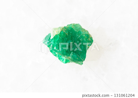 sample of rough emerald mineral on white 131061204