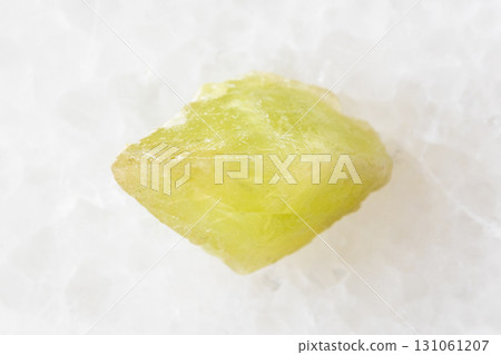 sample of rough sphene crystal on white marble 131061207