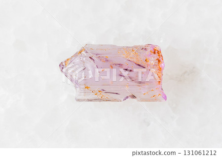 sample of rough purple scapolite crystal on white 131061212