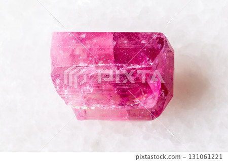 sample of rough rubellite crystal on white marble sample of rough rubellite crystal on white marble 131061221