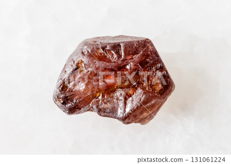 sample of raw hyacinth zircon crystal on white 131061224