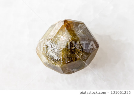sample of raw grossular garnet crystal on white sample of raw grossular garnet crystal on white 131061235