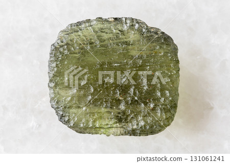 sample of rough moldavite tektite glass on white 131061241