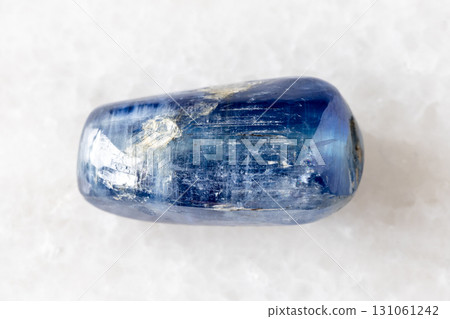 sample of tumbled blue kyanite gemstone on white 131061242