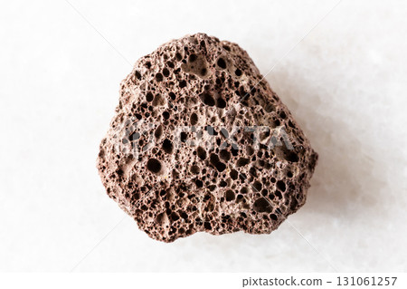 sample of rough brown pumice mineral on white sample of rough brown pumice mineral on white 131061257