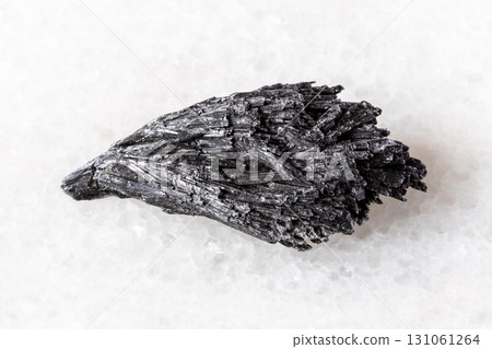 sample of rough black kyanite mineral on white sample of rough black kyanite mineral on white 131061264