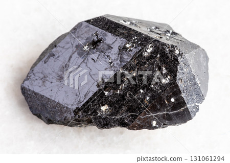 raw melanite andradite black garnet on white raw melanite andradite black garnet on white 131061294