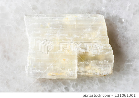 sample of raw eudidymite mineral on white marble sample of raw eudidymite mineral on white marble 131061301