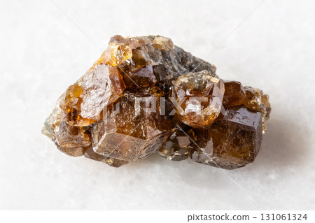 raw hessonite grossular crystals on white raw hessonite grossular crystals on white 131061324