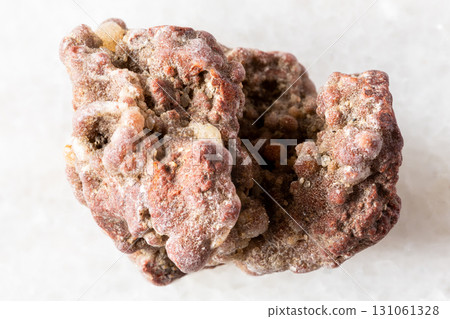 sample of rough chalcedony mineral on white marble 131061328