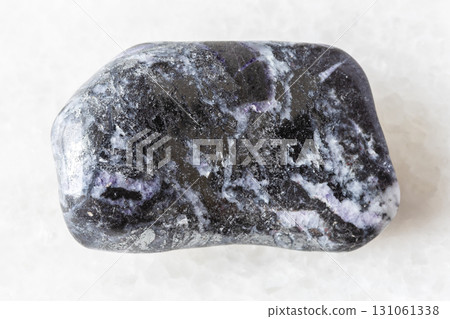 sample of polished stibnite mineral on white sample of polished stibnite mineral on white 131061338