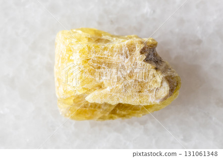 sample of raw yellow tourmaline mineral on white sample of raw yellow tourmaline mineral on white 131061348