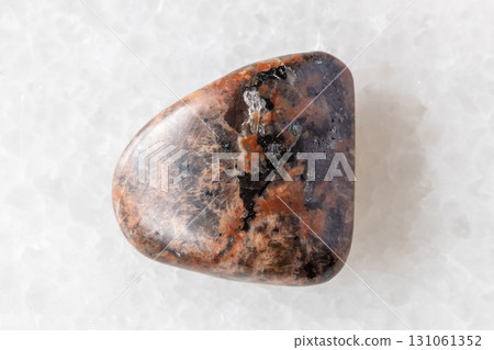 sample of polished syenogranite rock on white 131061352