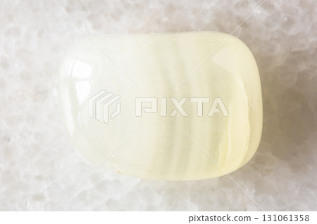 sample of polished colorless calcite rock on white 131061358