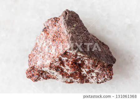 sample of raw analcimolite mineral on white marble sample of raw analcimolite mineral on white marble 131061368