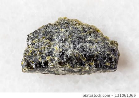 sample of rough diopside rock on white marble sample of rough diopside rock on white marble 131061369