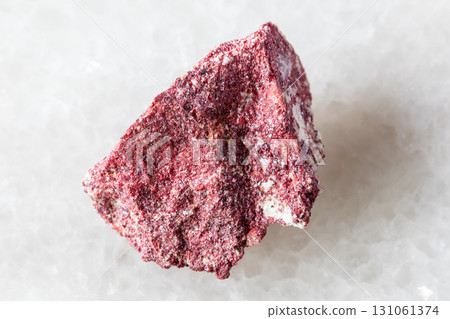 sample of rough cinnabar mineral on white marble sample of rough cinnabar mineral on white marble 131061374