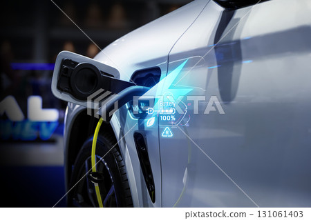 Power cable pump plug in charging power to electric vehicle EV car. 131061403
