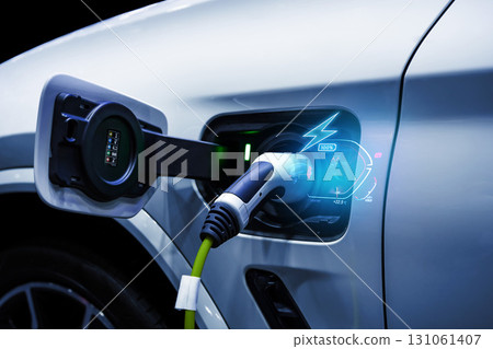 Power cable pump plug in charging power to electric vehicle EV car. 131061407