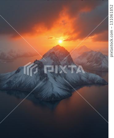 A beautiful northern landscape at sunset, with snow-covered mountains and a lake. 131061852