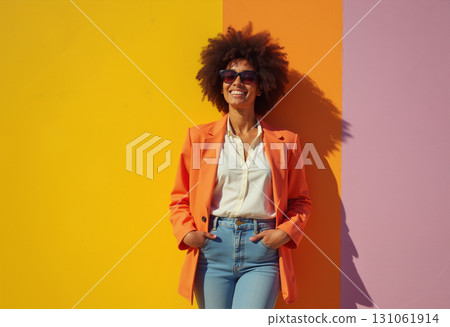 A depiction of a woman standing against a wall adorned with a vibrant array of hues. 131061914