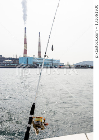 fishing in Avacha bay and view of power station fishing in Avacha bay and view of power station 131061930