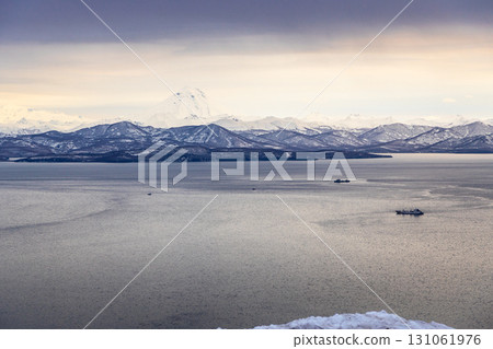 yellow sunset over Avacha Bay in spring evening 131061976