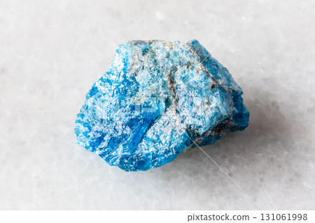 sample of unworked apatite rock on white marble sample of unworked apatite rock on white marble 131061998