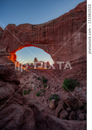 Turret arch through the North Window during sunset in Arches National Park, Utah, USA Turret arch through the North Window during sunset in Arches National Park, Utah, USA 131062028