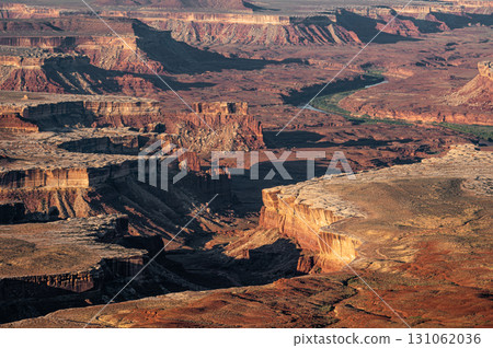 The Green River cuts the landscape. Eroded rugged scenery in Canyonlands National Park, Utah, USA 131062036