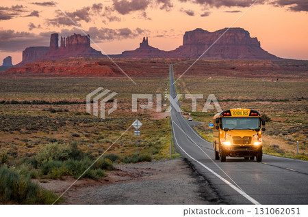 School bus on US highway route 163 during sunrise at Forrest Gump Point in Utah, USA 131062051