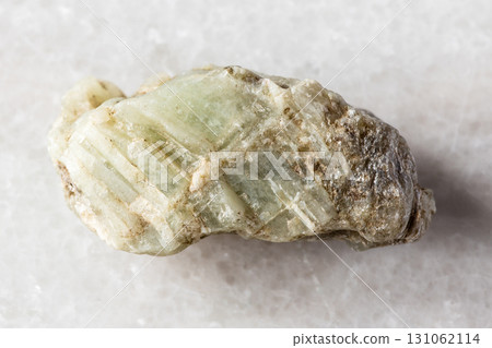 sample of raw beryl mineral on white marble 131062114
