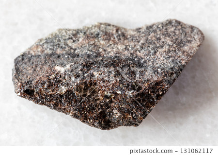 sample of raw phlogopite mica on white marble 131062117