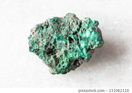 sample of raw malachite mineral on white marble sample of raw malachite mineral on white marble 131062118