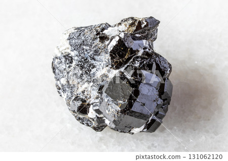 raw melanite andradite black garnets on white raw melanite andradite black garnets on white 131062120