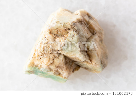 sample of raw amazonite mineral on white marbl sample of raw amazonite mineral on white marbl 131062173