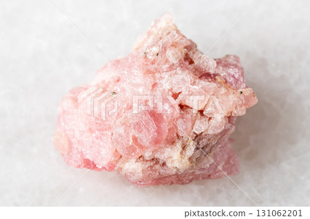 sample of raw rhodochrosite mineral on white sample of raw rhodochrosite mineral on white 131062201