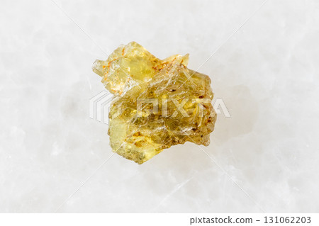 sample of rough sinhalite mineral on white marble 131062203